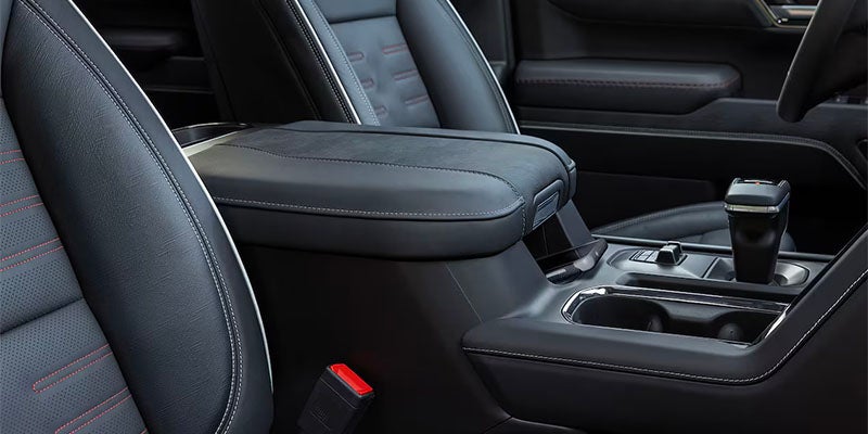 Side image view of the interior of a 2025 GMC Sierra 1500 AT4X showing the seats of the back and front seats